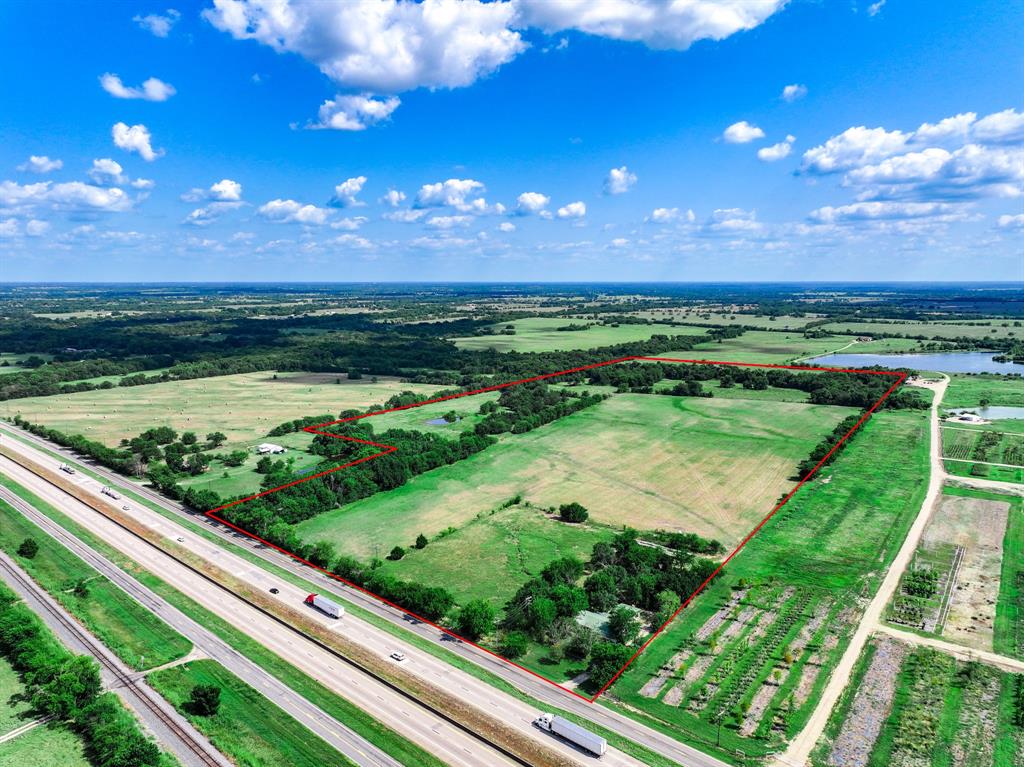 7801 West Interstate Highway Cumby, TX 75433 - Photo 15 of 31 a view of a garden from a balcony