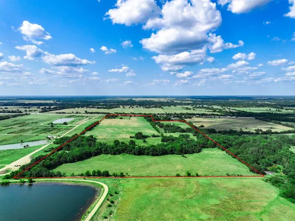 a view of a golf course with a big yard