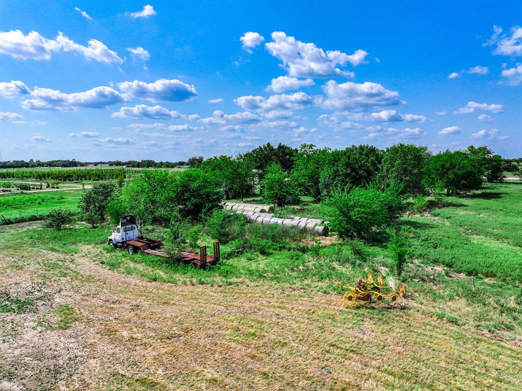 7801 West Interstate Highway Cumby, TX 75433 - Photo 28 of 31 a view of a garden with a house