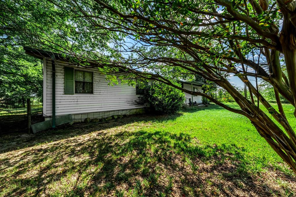 7801 West Interstate Highway Cumby, TX 75433 - Photo 3 of 31 a backyard of a house with lots of green space