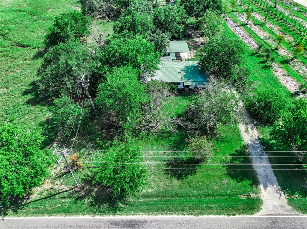 7801 West Interstate Highway Cumby, TX 75433 - Photo 9 of 31 a view of a garden with a fountain