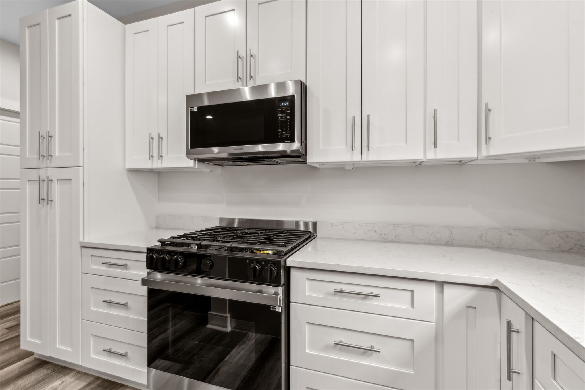 2017 Ryan Road Fernandina Beach, FL 32034 - Photo 11 of 39 a kitchen with stainless steel appliances white cabinets and a stove a oven with white countertops