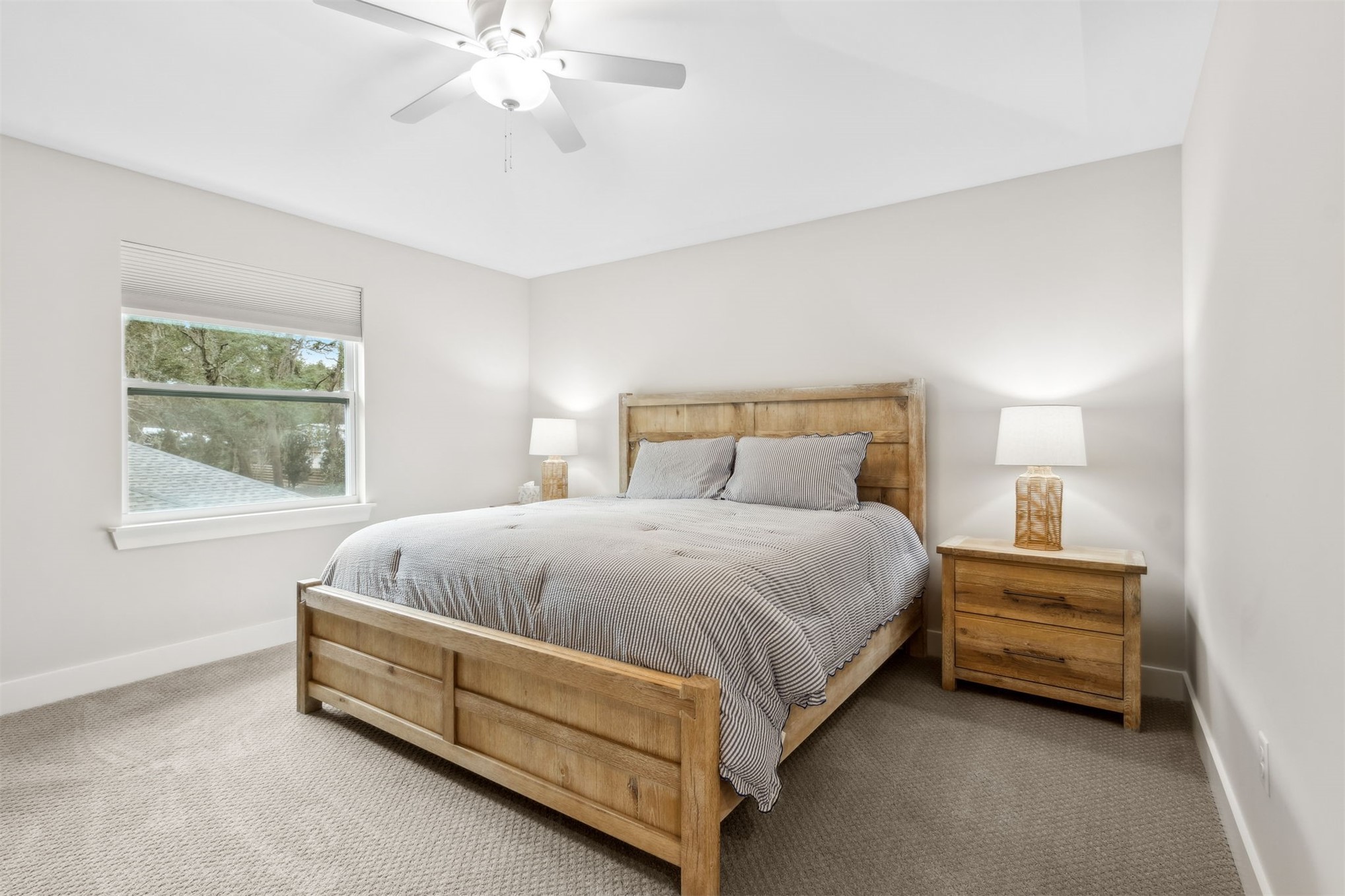 2017 Ryan Road Fernandina Beach, FL 32034 - Photo 13 of 39 a bed sitting in a bedroom next to a window