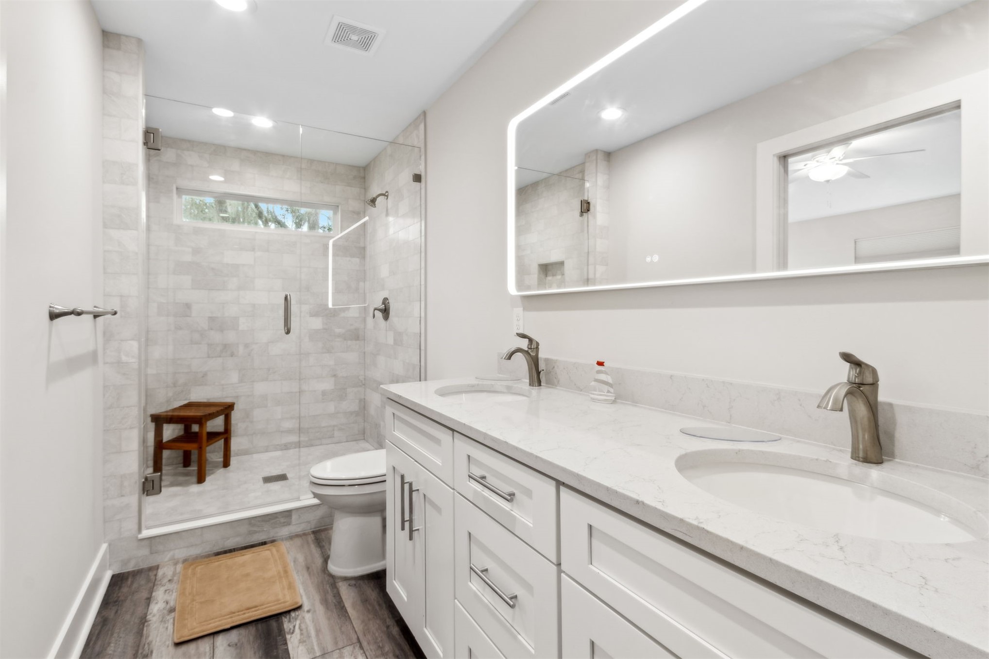 2017 Ryan Road Fernandina Beach, FL 32034 - Photo 16 of 39 a bathroom with a sink a toilet a mirror and shower