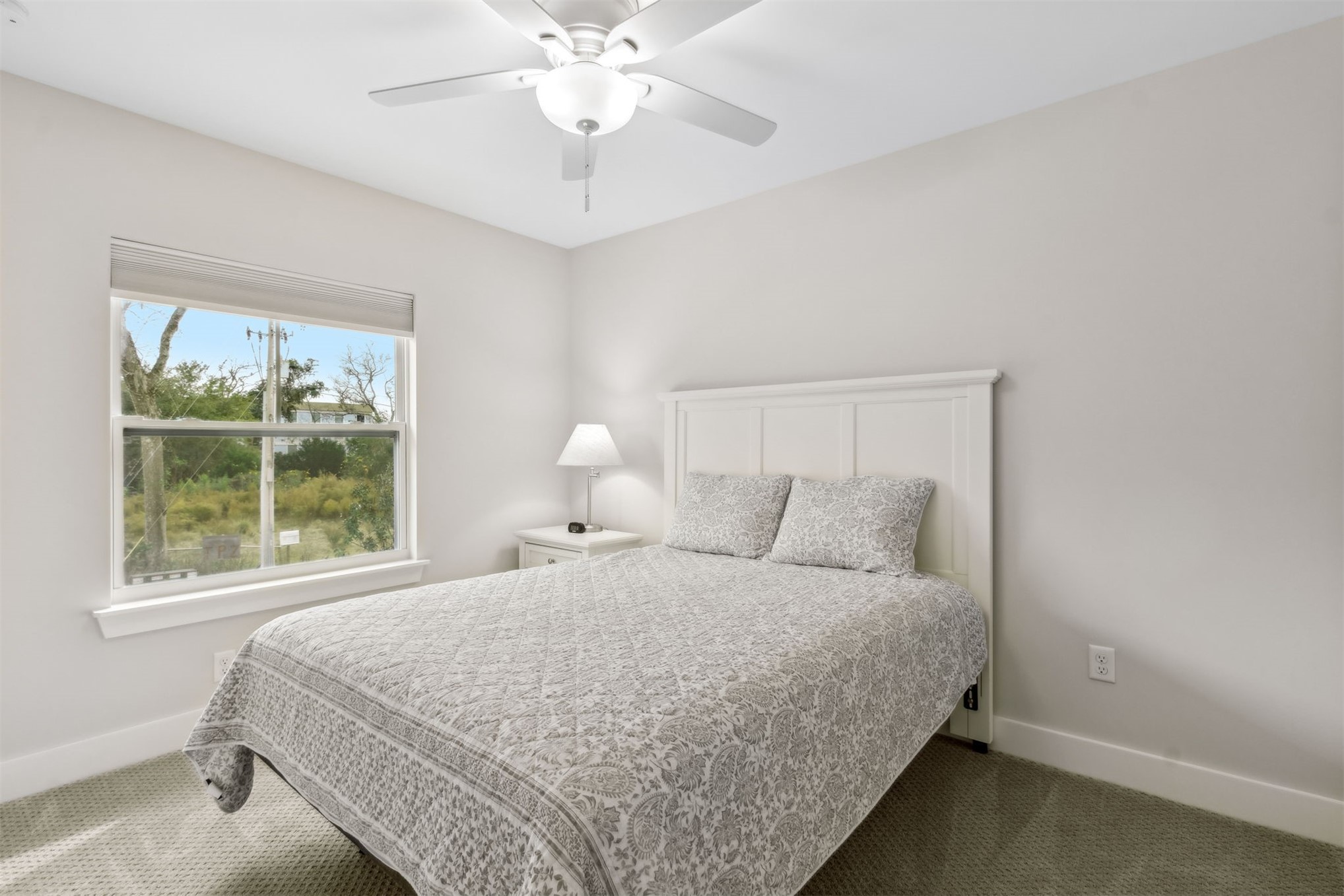 2017 Ryan Road Fernandina Beach, FL 32034 - Photo 20 of 39 a bedroom with a large bed and a window