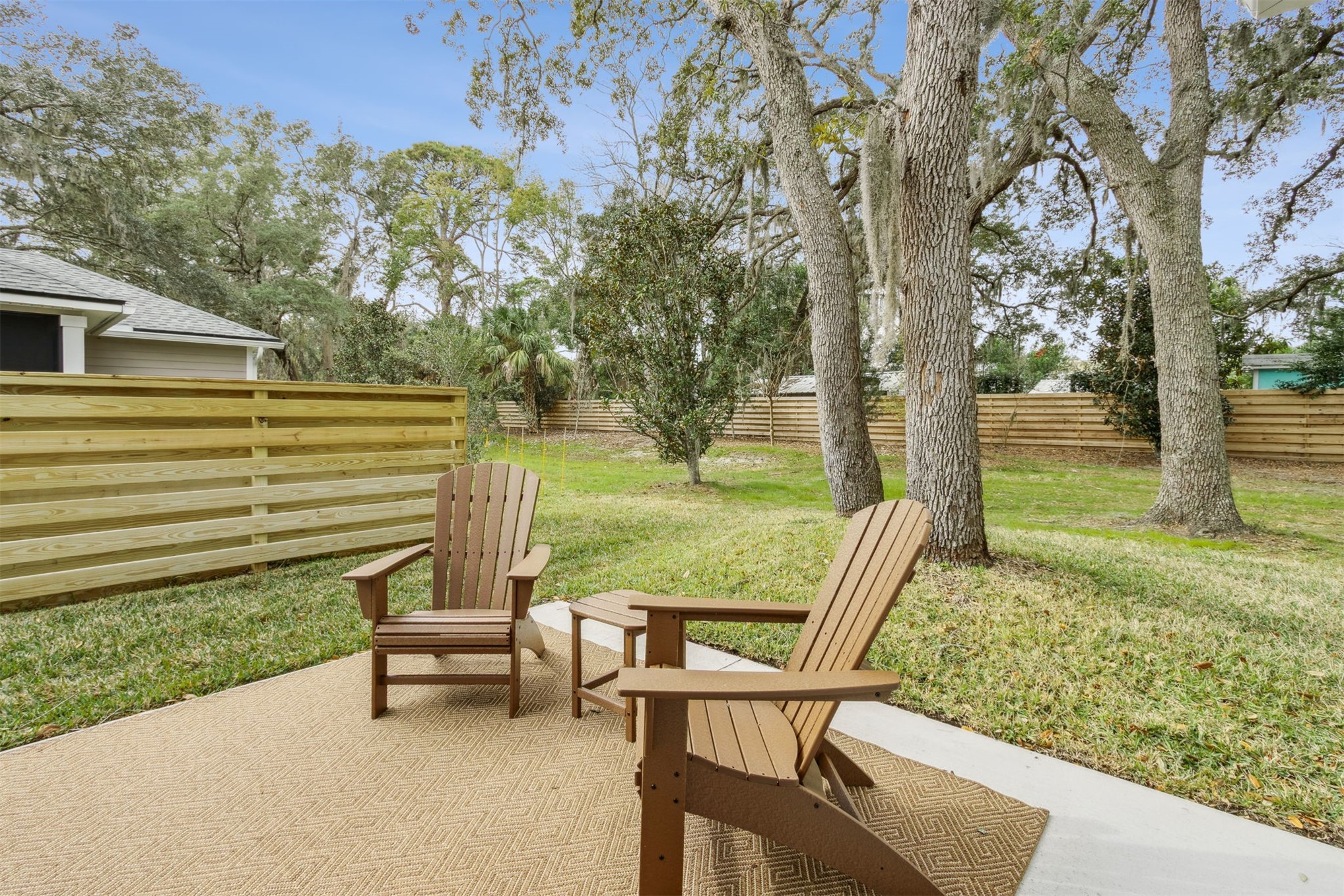 2017 Ryan Road Fernandina Beach, FL 32034 - Photo 30 of 39 a view of a two chair and table in the back yard