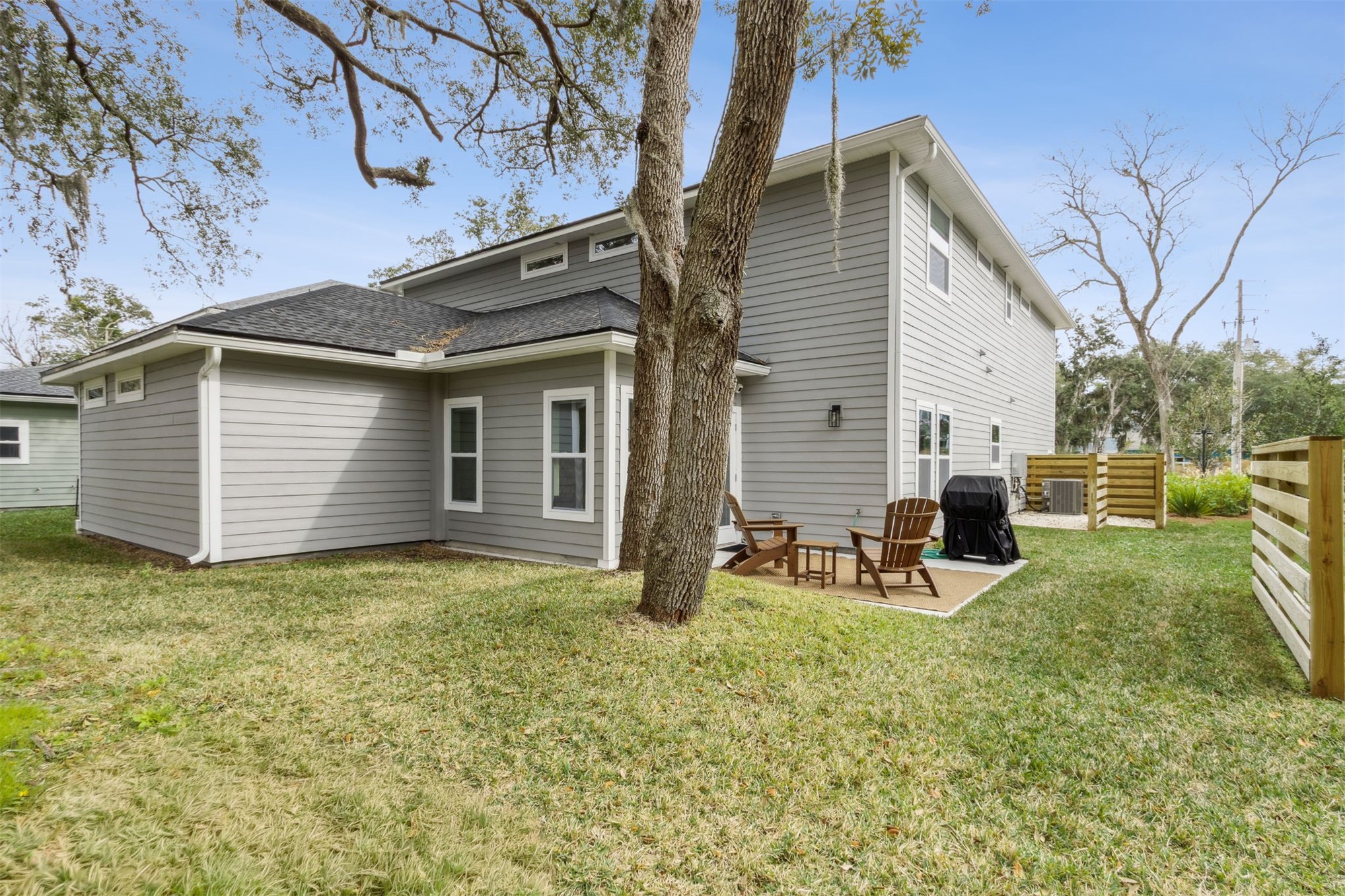 2017 Ryan Road Fernandina Beach, FL 32034 - Photo 31 of 39 a view of backyard of house with wooden deck and furniture