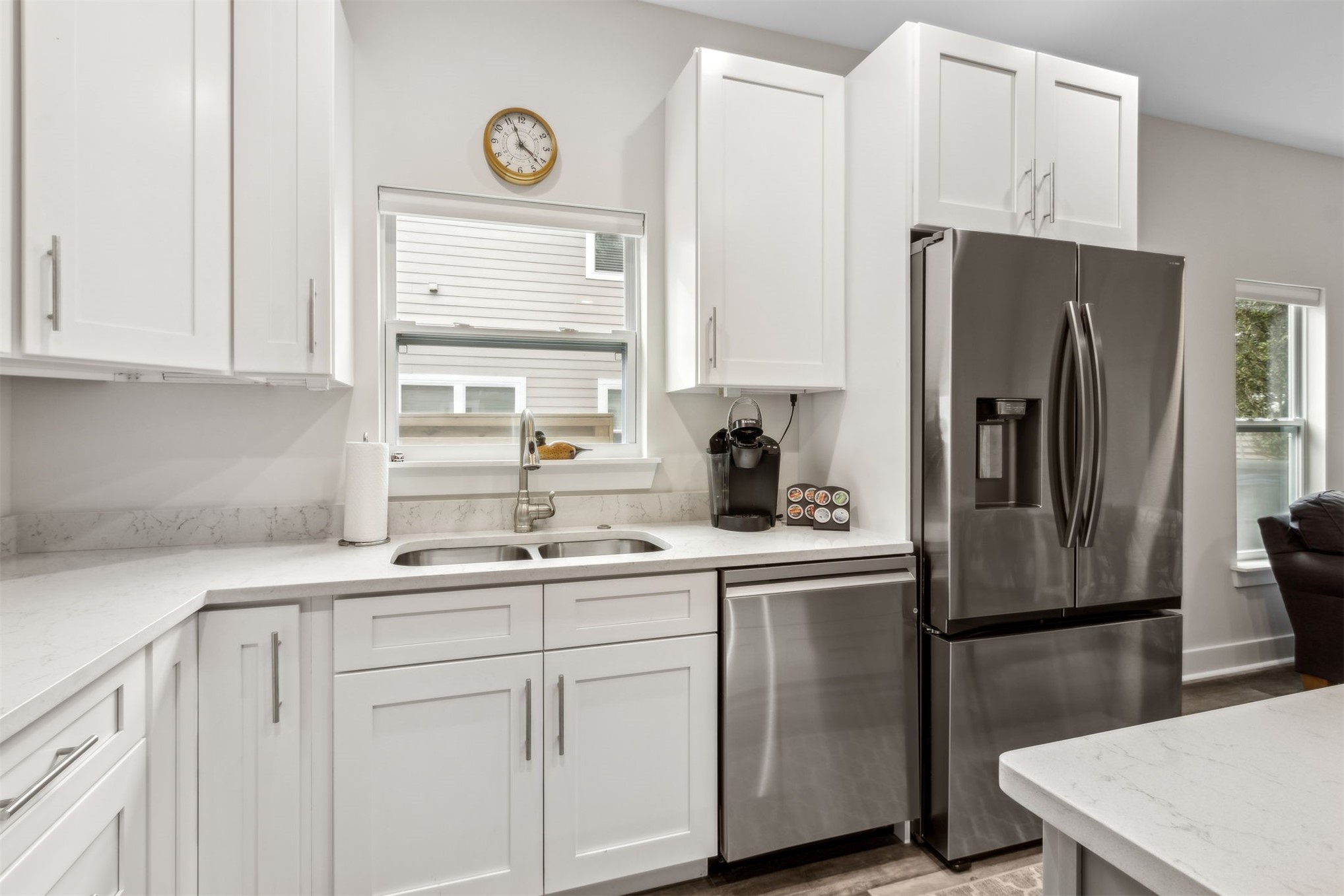2017 Ryan Road Fernandina Beach, FL 32034 - Photo 10 of 39 a kitchen with a sink a refrigerator a window and cabinets