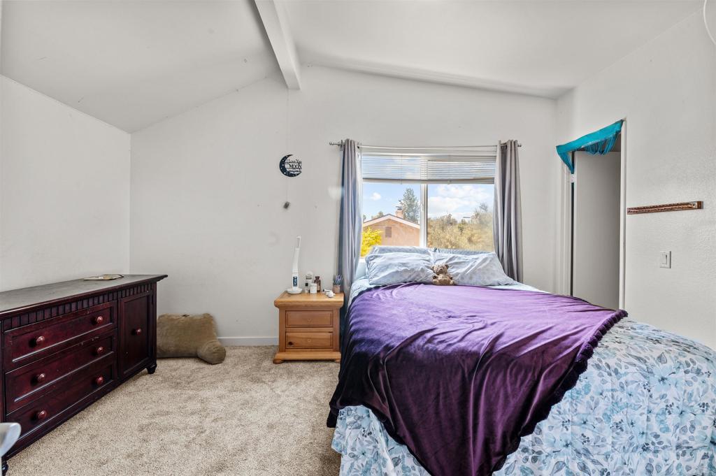 772 Barsby Street Vista, CA 92084 - Photo 19 of 28 a bedroom with a bed and a dresser