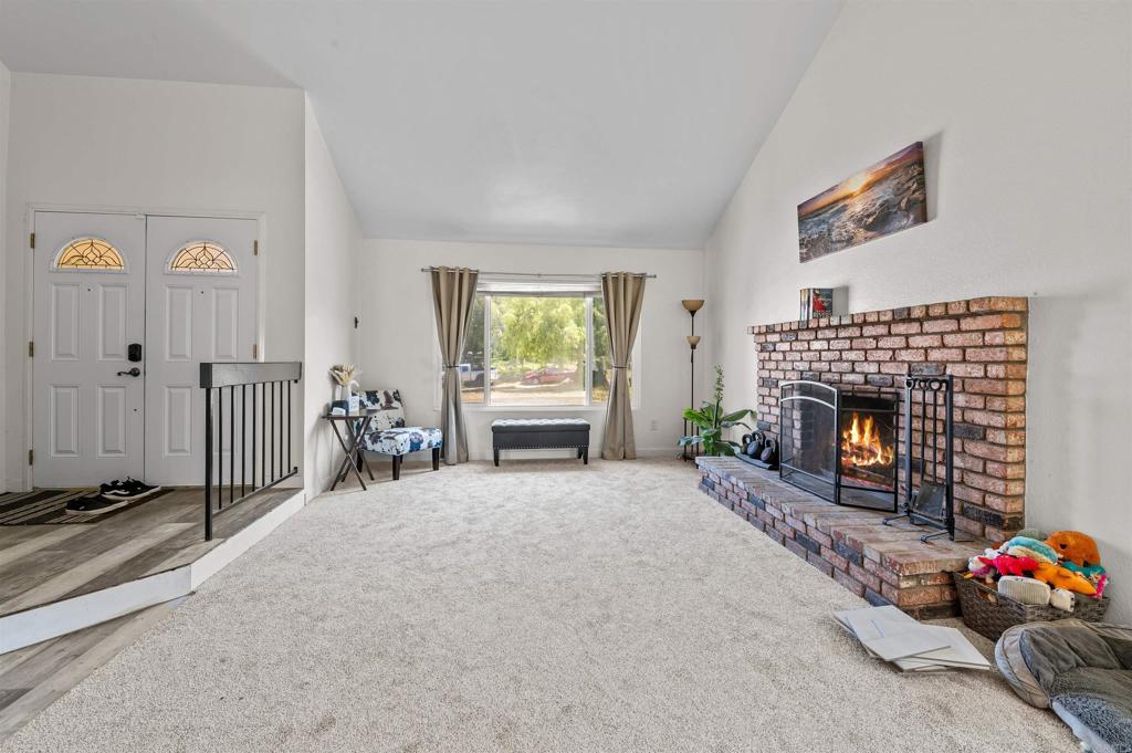 772 Barsby Street Vista, CA 92084 - Photo 6 of 28 a living room with furniture and a fireplace