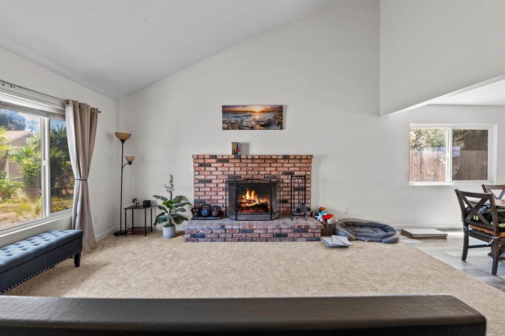 772 Barsby Street Vista, CA 92084 - Photo 7 of 28 a living room with furniture and a fireplace