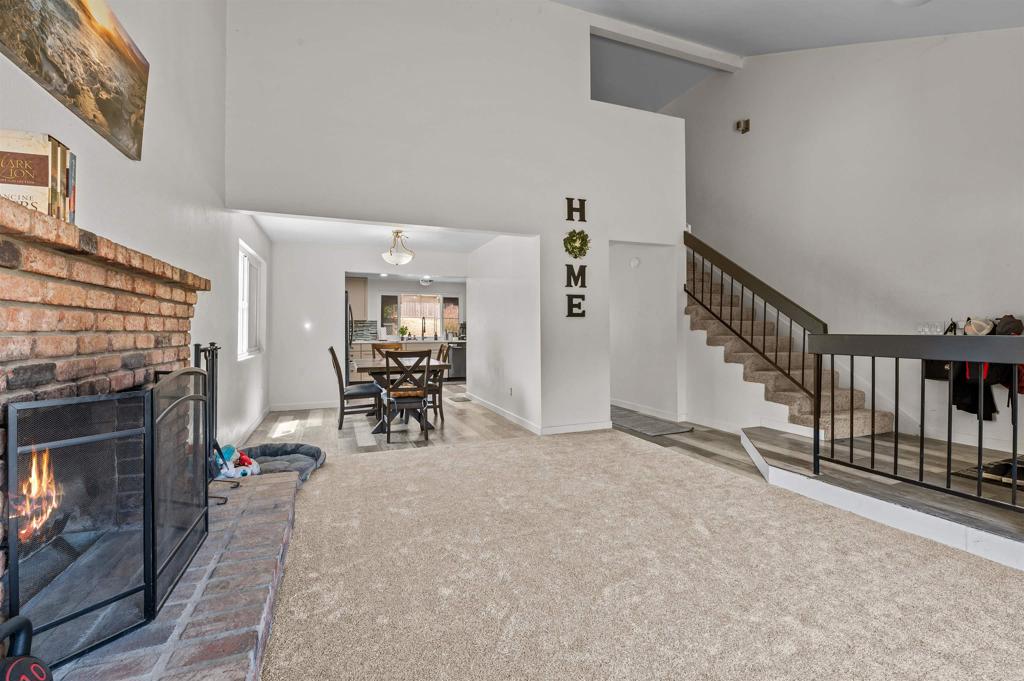 772 Barsby Street Vista, CA 92084 - Photo 8 of 28 a view of a livingroom with a fireplace and workspace