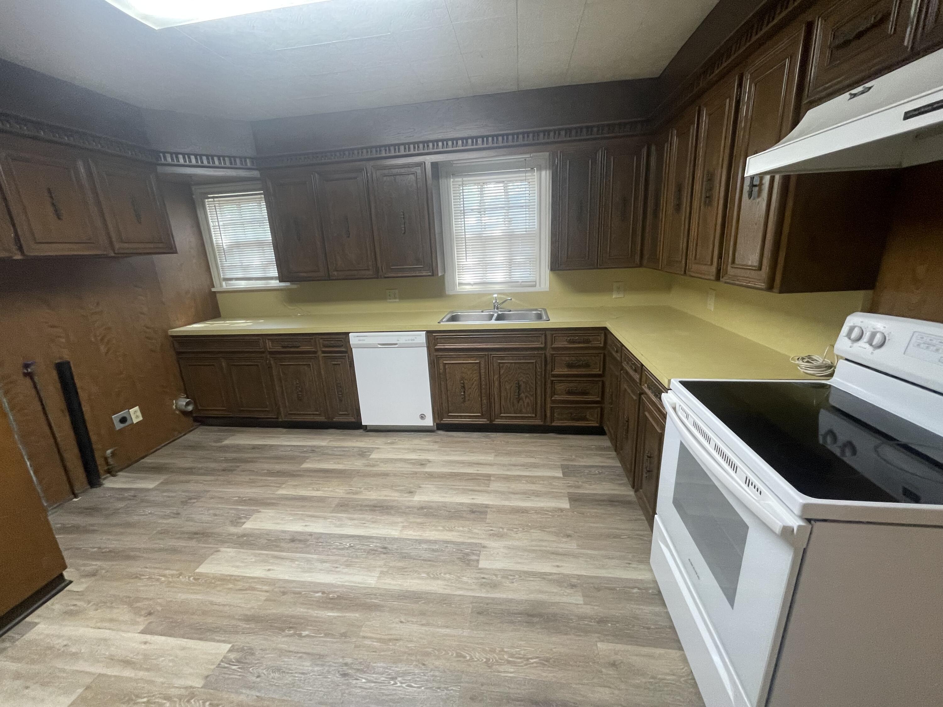 2820 36th Street Lubbock, TX 79413 - Photo 4 of 11 a kitchen with sink cabinets and window