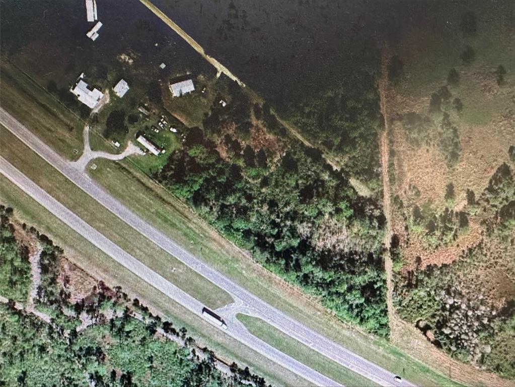 60 East State Road Okeechobee, FL 34972 - Photo 2 of 7 a bathroom with a bathtub and shower