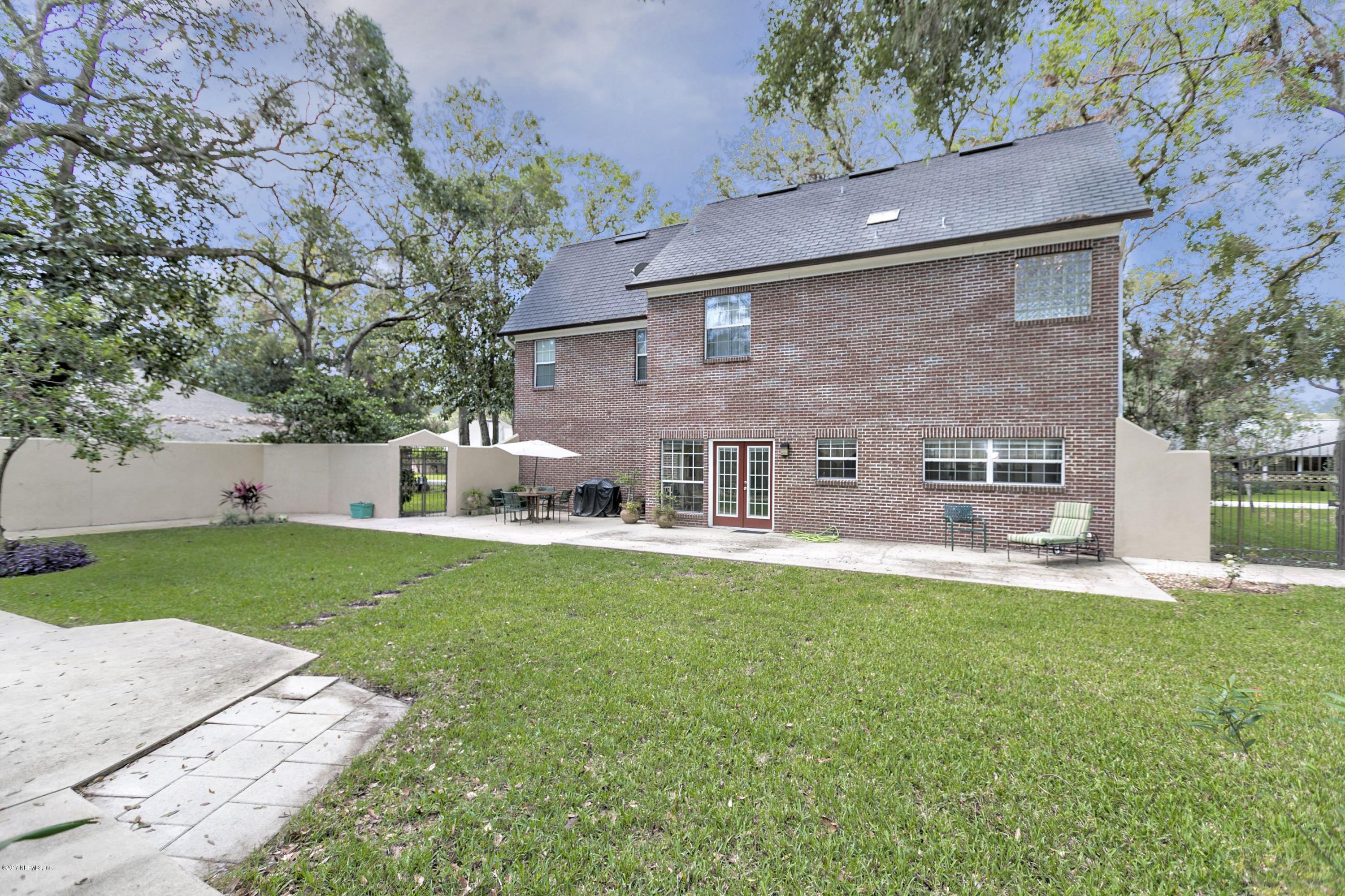 3301 Turtle Creek Road St. Augustine, FL 32086 - Photo 23 of 26 front view of a house with a yard