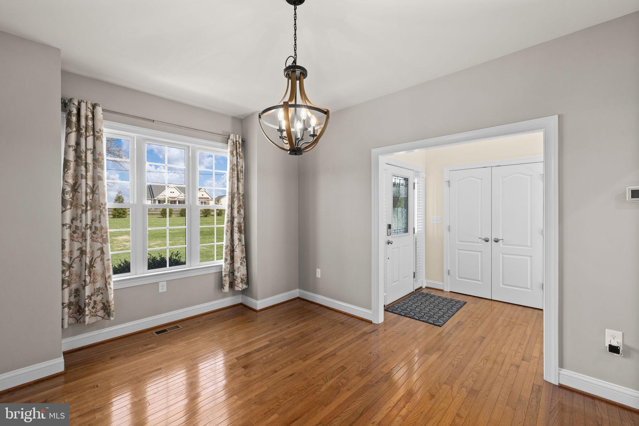 240 Poplar Road Fredericksburg, VA 22406 - Photo 11 of 77 a view of an empty room with wooden floor and fan