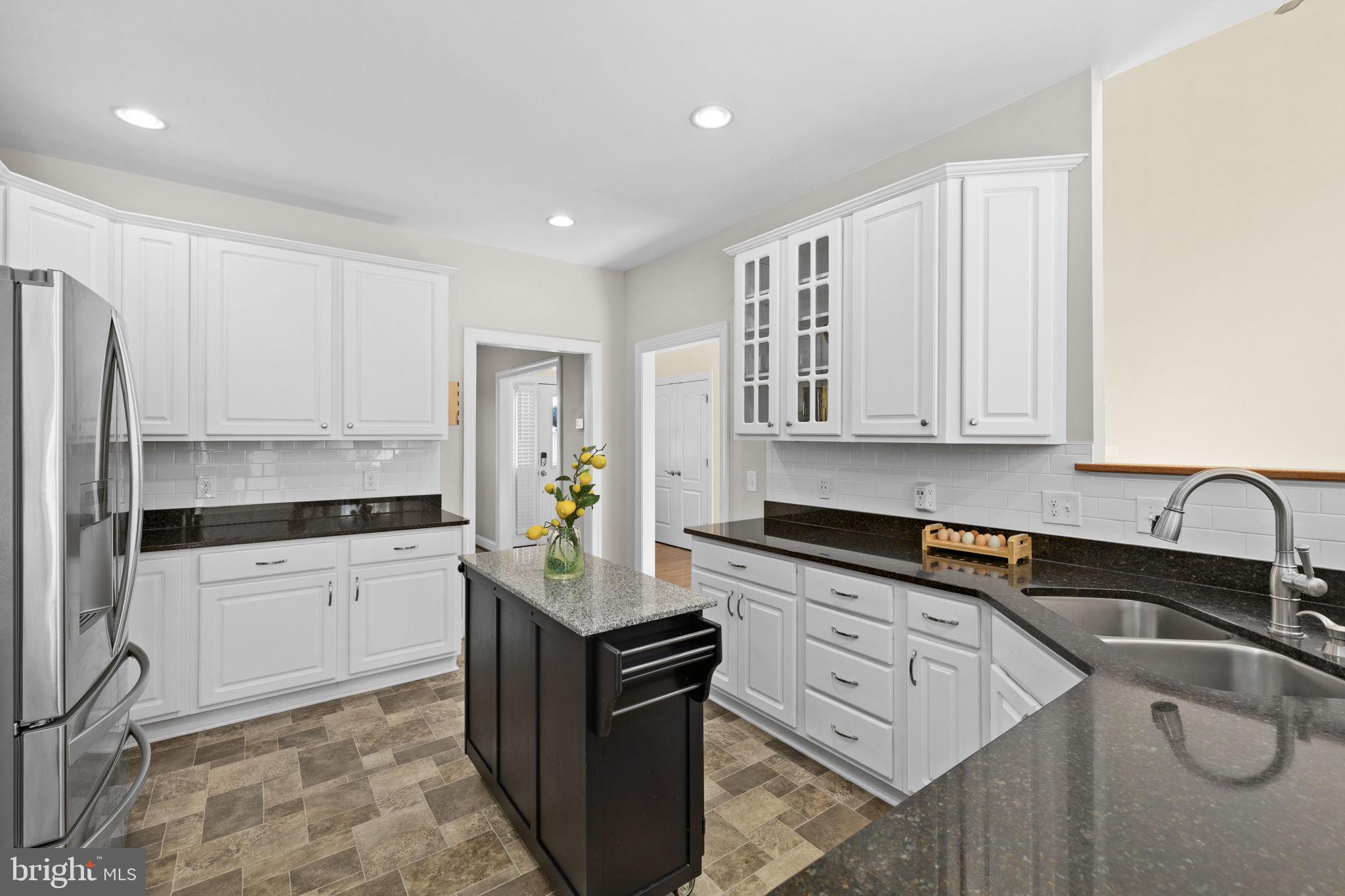 240 Poplar Road Fredericksburg, VA 22406 - Photo 15 of 77 a kitchen with granite countertop a sink stainless steel appliances and cabinets
