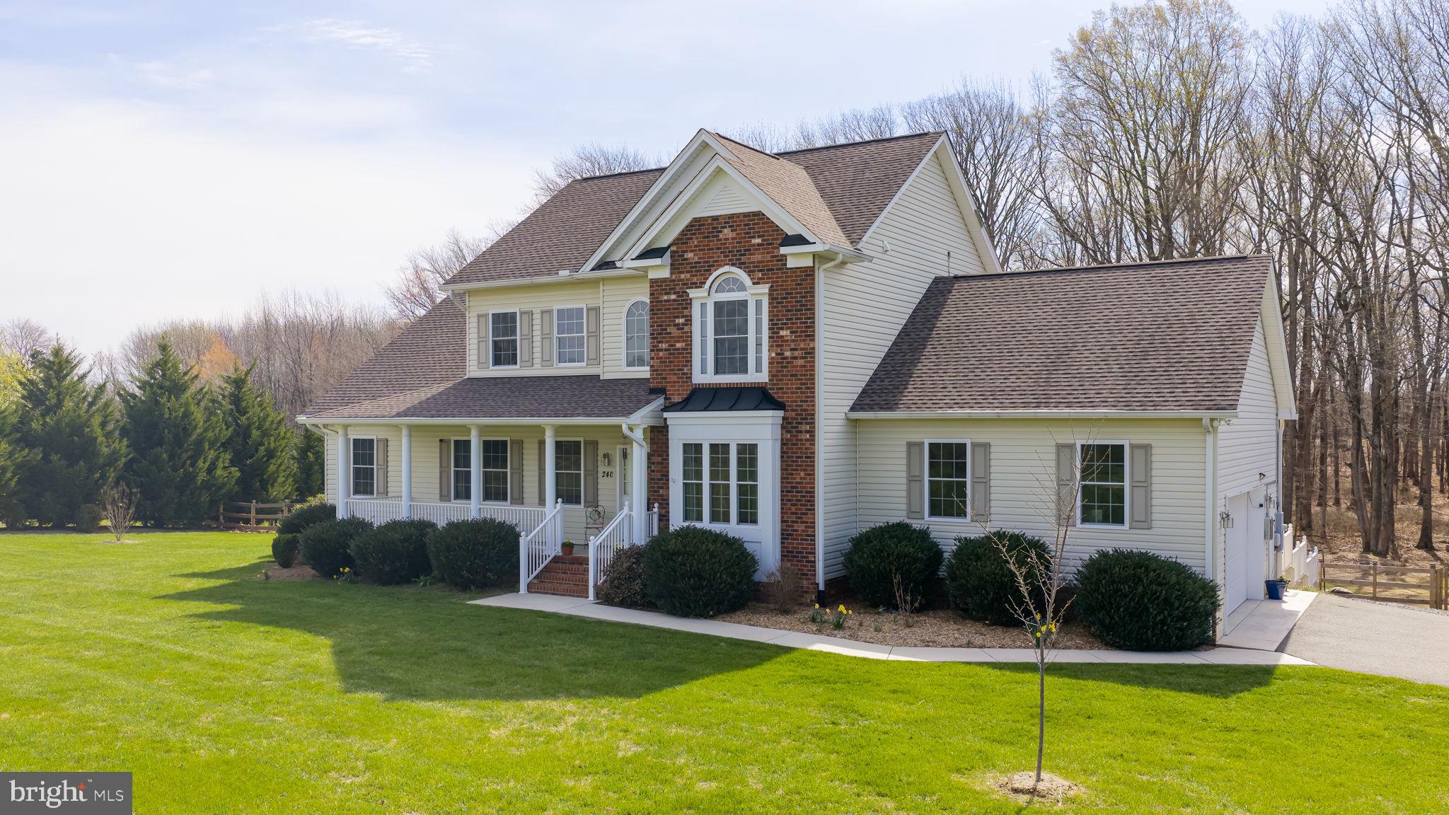240 Poplar Road Fredericksburg, VA 22406 - Photo 2 of 77 a front view of a house with a yard
