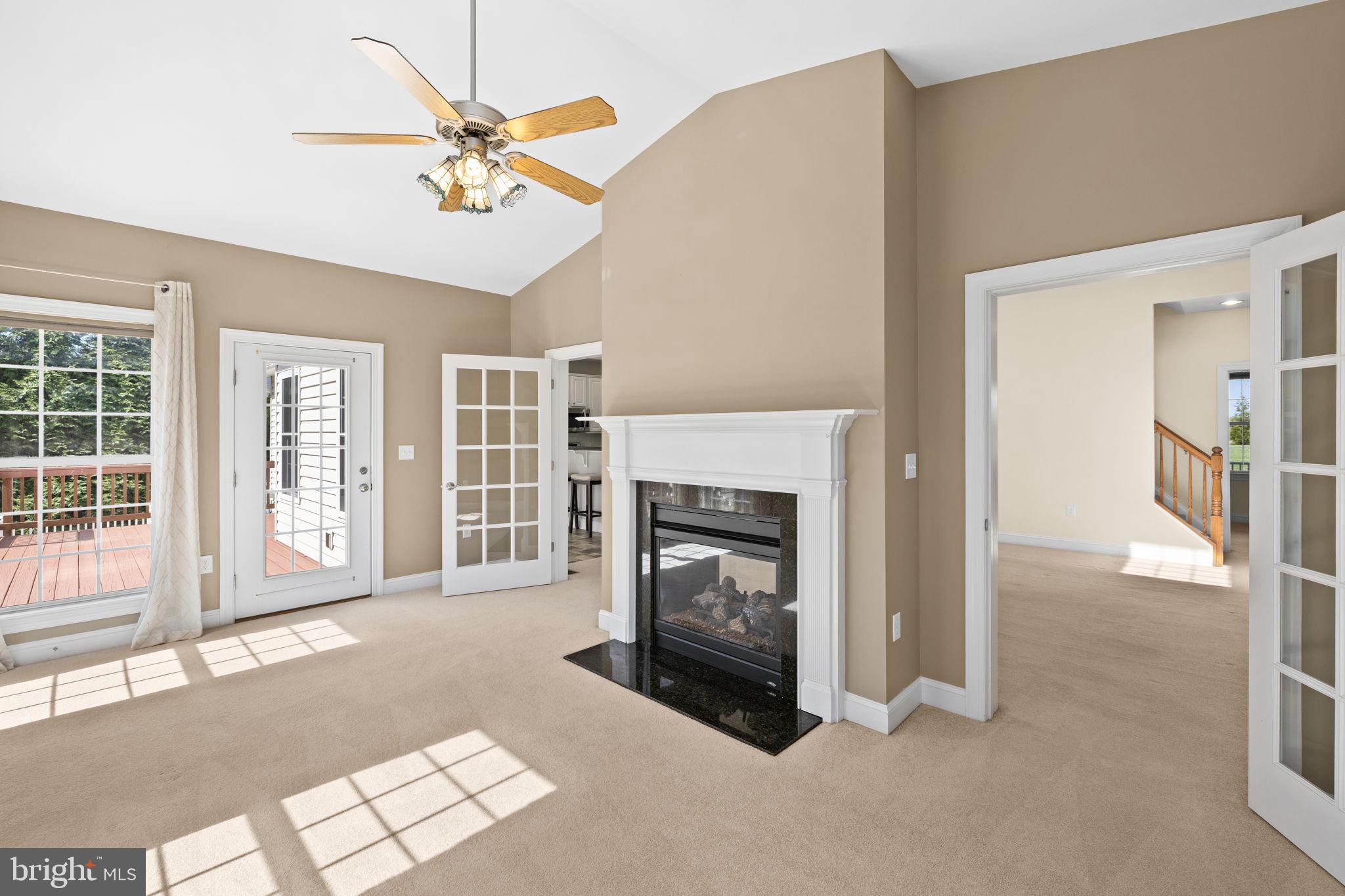 240 Poplar Road Fredericksburg, VA 22406 - Photo 30 of 77 a living room with furniture and a fireplace