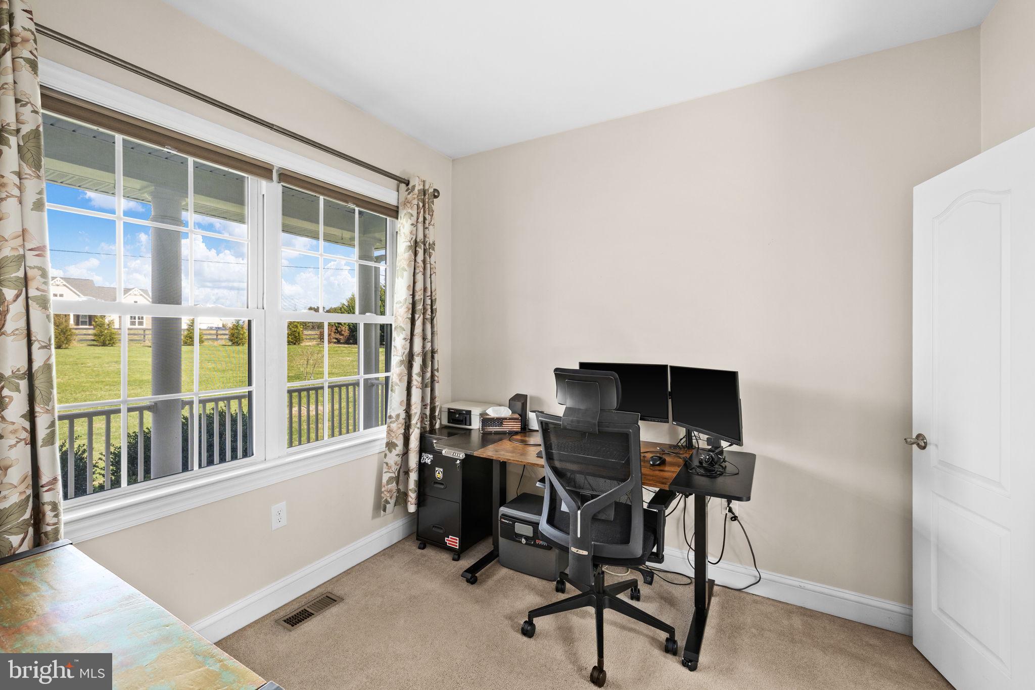240 Poplar Road Fredericksburg, VA 22406 - Photo 31 of 77 a view of a workspace with furniture and a window