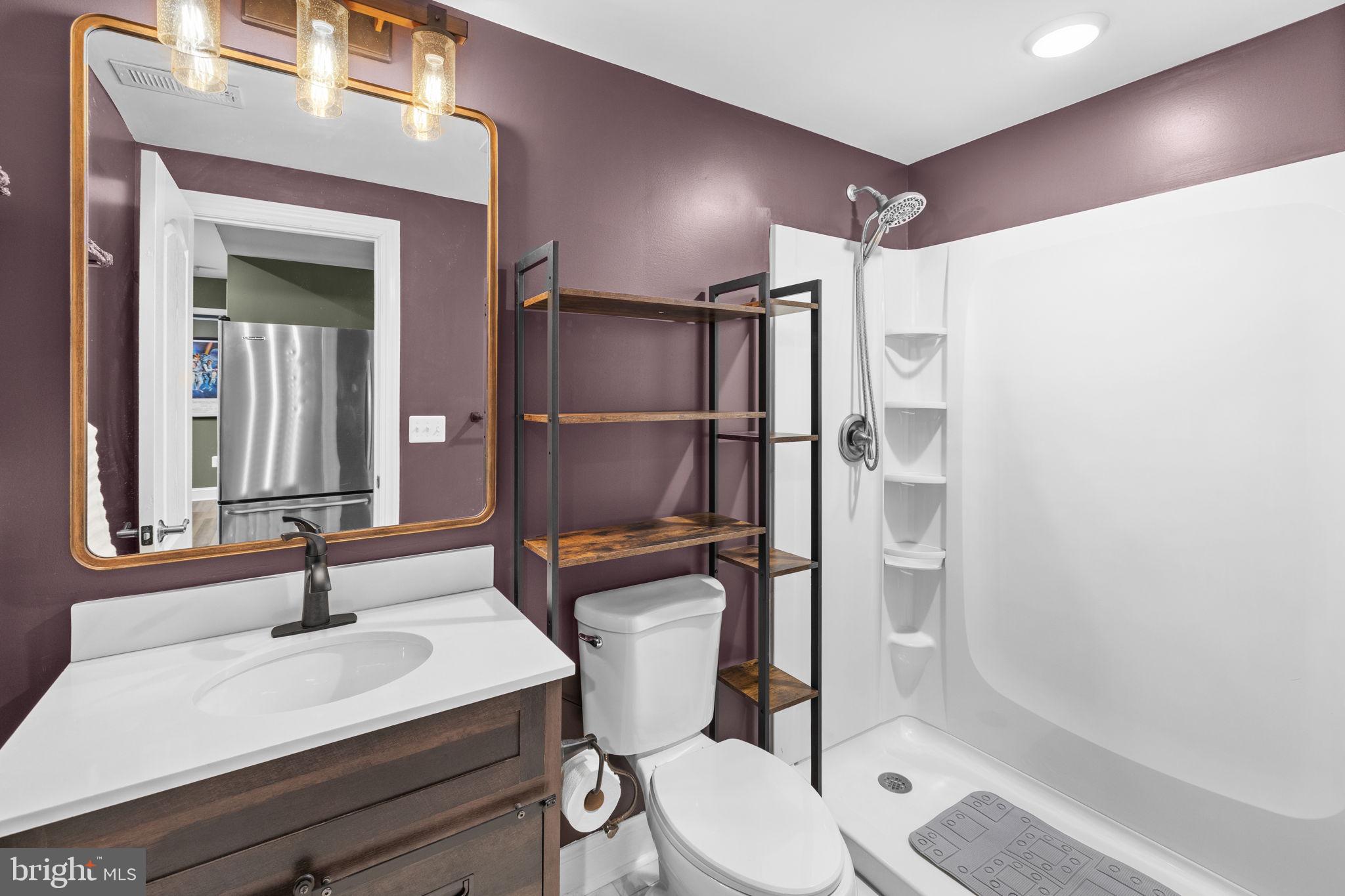 240 Poplar Road Fredericksburg, VA 22406 - Photo 58 of 77 a bathroom with a sink toilet and shower