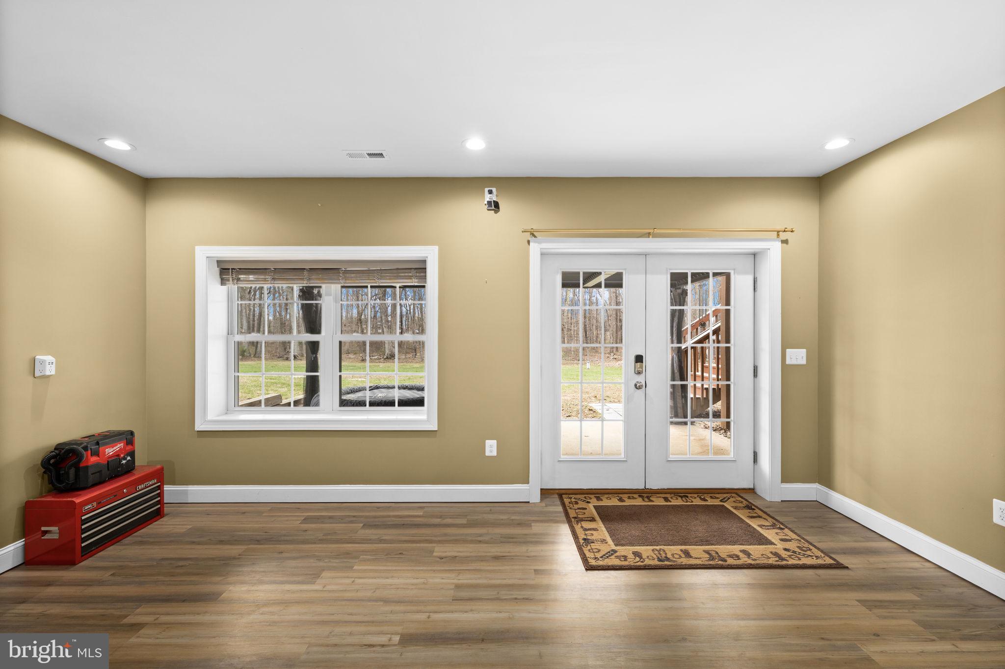 240 Poplar Road Fredericksburg, VA 22406 - Photo 59 of 77 a view of an empty room with window and wooden floor