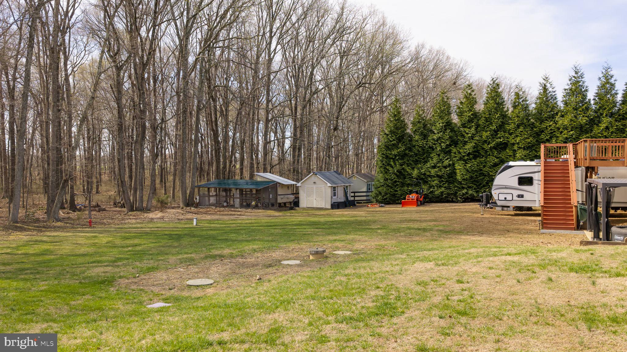 240 Poplar Road Fredericksburg, VA 22406 - Photo 67 of 77 a front view of a house with a yard and trees