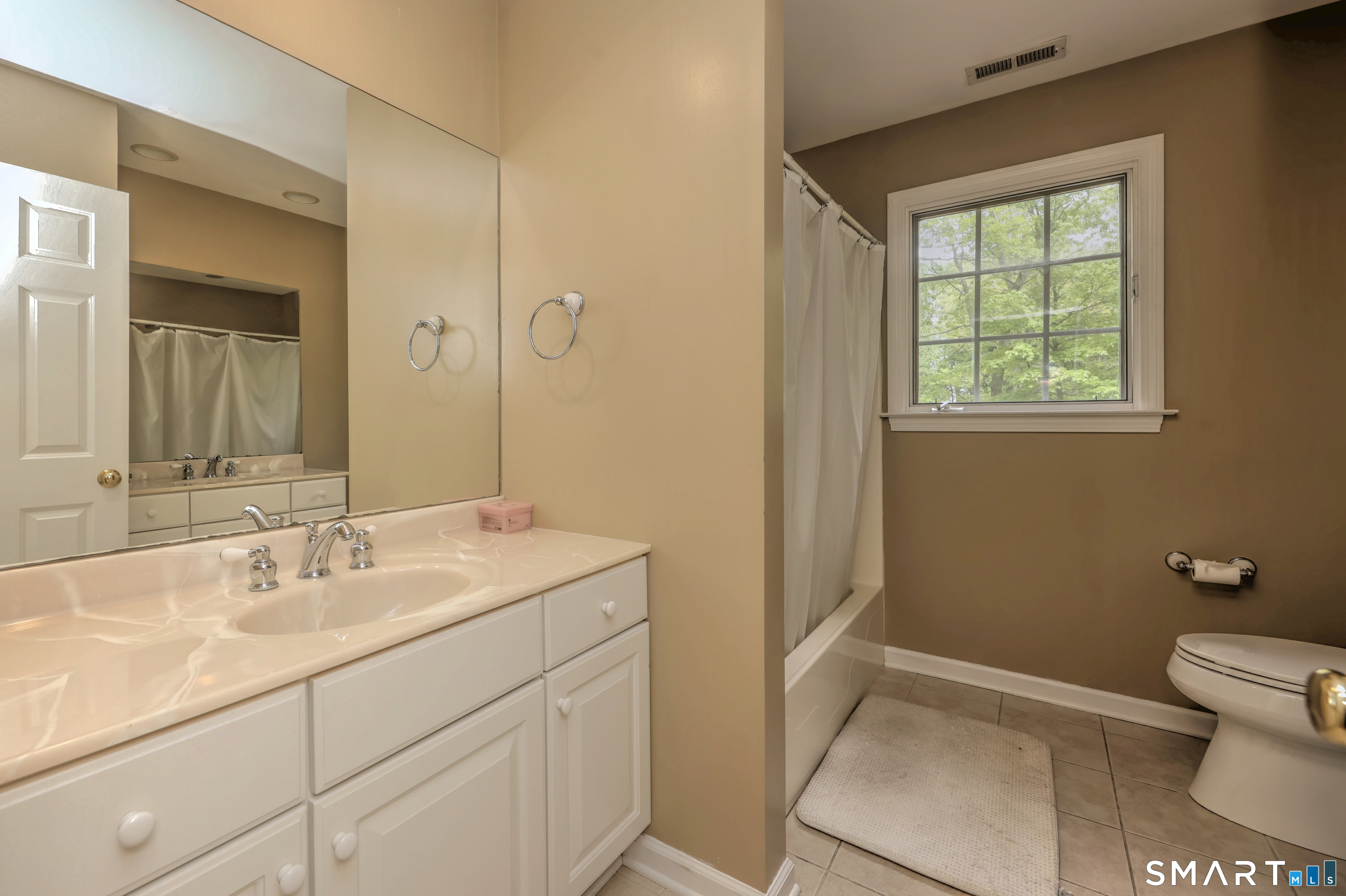 125 Peck Hill Road Woodbridge, CT 06525 - Photo 30 of 40 a bathroom with a sink toilet and vanity
