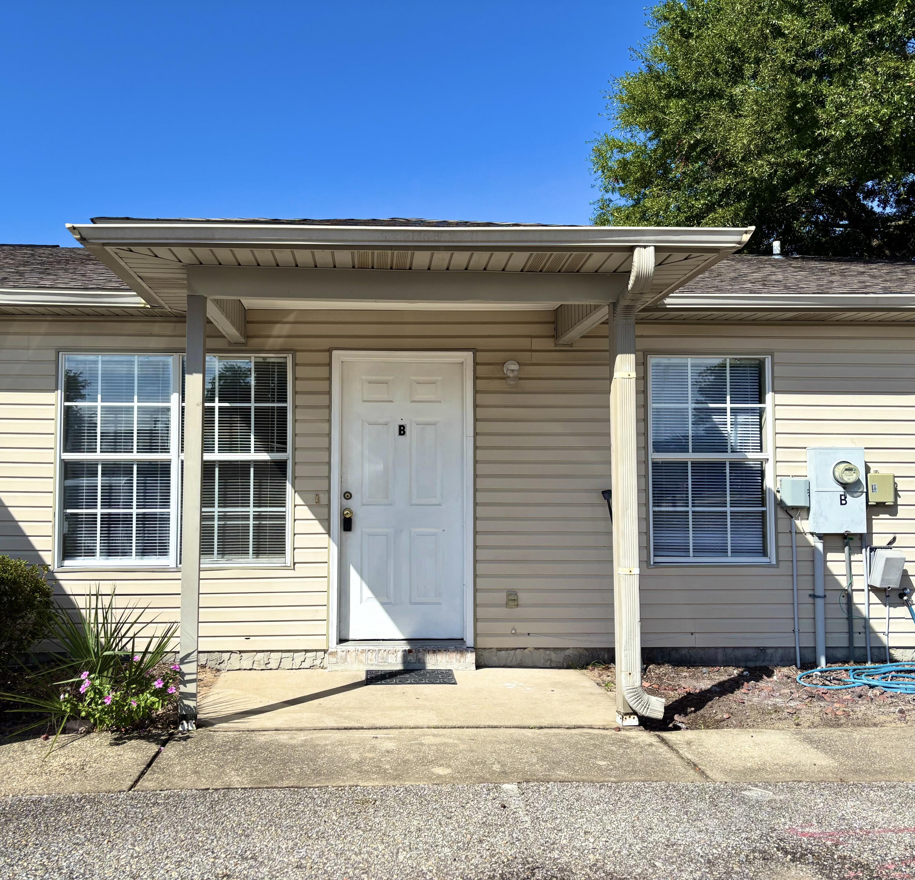 6903 Sea Turtle Circle, Unit B Navarre, FL 32566 - Photo 2 of 10 front view of a house