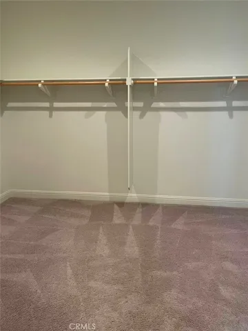 a view of hallway with closet