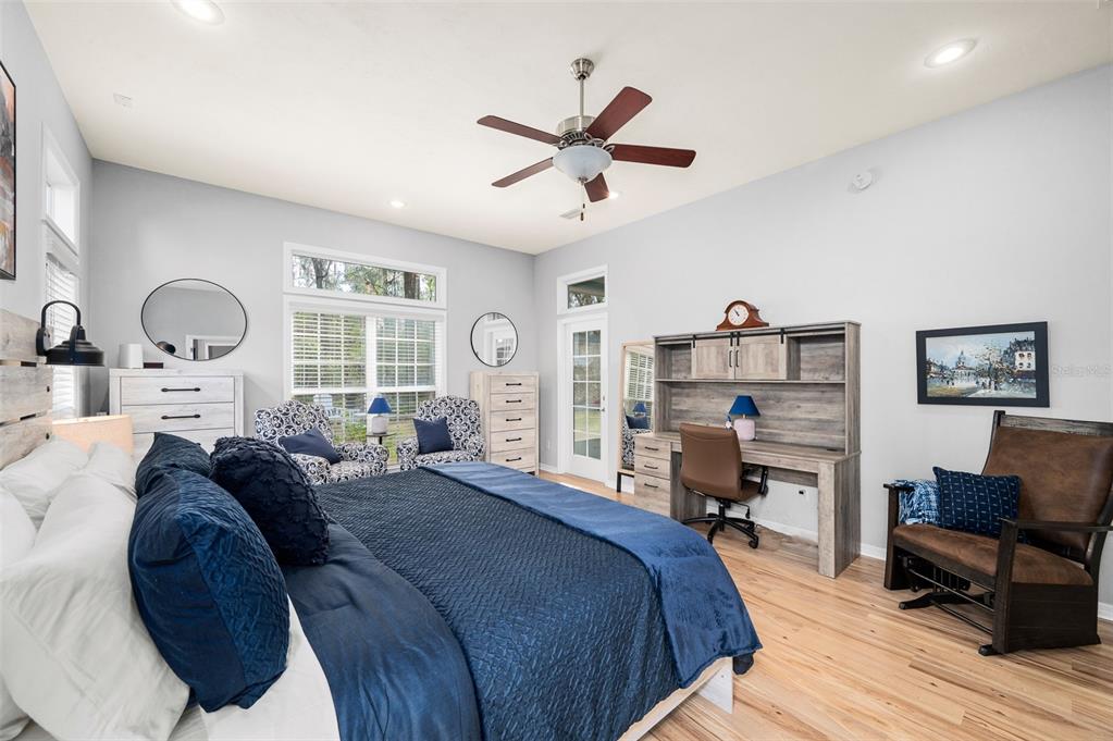 6377 Southwest 88th Terrace Gainesville, FL 32608 - Photo 17 of 37 a bedroom with a bed furniture and windows