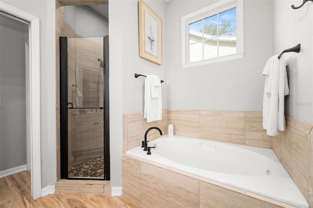 6377 Southwest 88th Terrace Gainesville, FL 32608 - Photo 21 of 37 a bathroom with a bathtub and shower