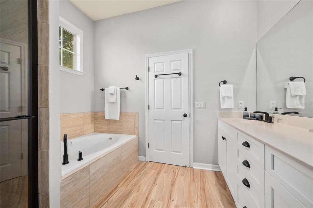 6377 Southwest 88th Terrace Gainesville, FL 32608 - Photo 22 of 37 a bathroom with a bathtub and a sink