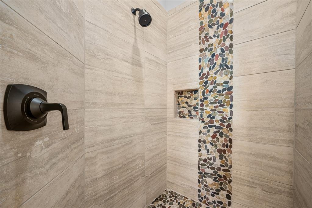 6377 Southwest 88th Terrace Gainesville, FL 32608 - Photo 23 of 37 a bathroom with a shower