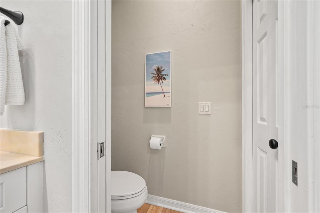 6377 Southwest 88th Terrace Gainesville, FL 32608 - Photo 24 of 37 a white toilet sitting next to a bathroom sink
