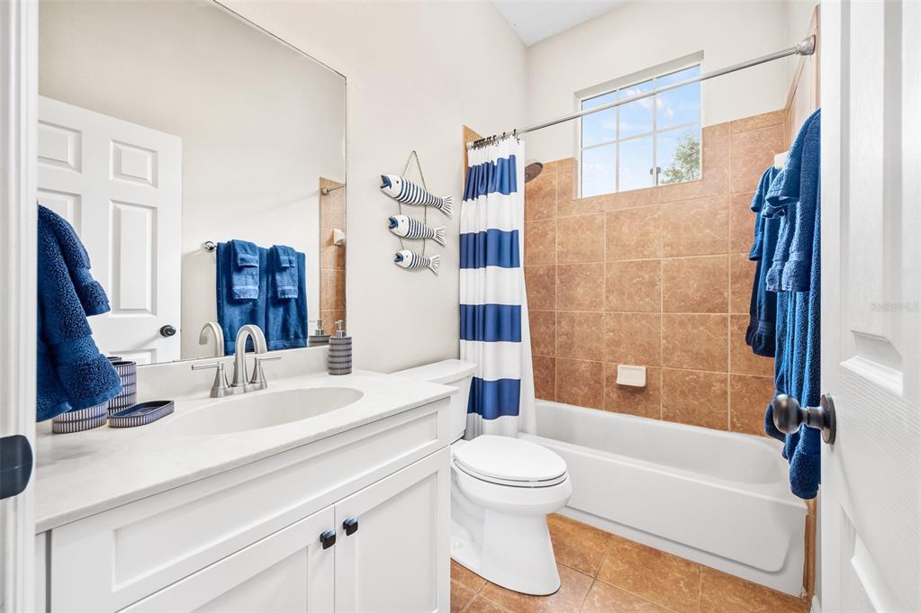 6377 Southwest 88th Terrace Gainesville, FL 32608 - Photo 28 of 37 a bathroom with a sink toilet and shower