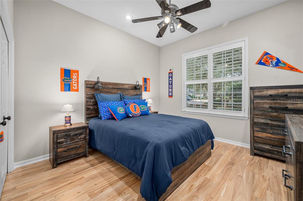 6377 Southwest 88th Terrace Gainesville, FL 32608 - Photo 29 of 37 a bedroom with a bed and a window