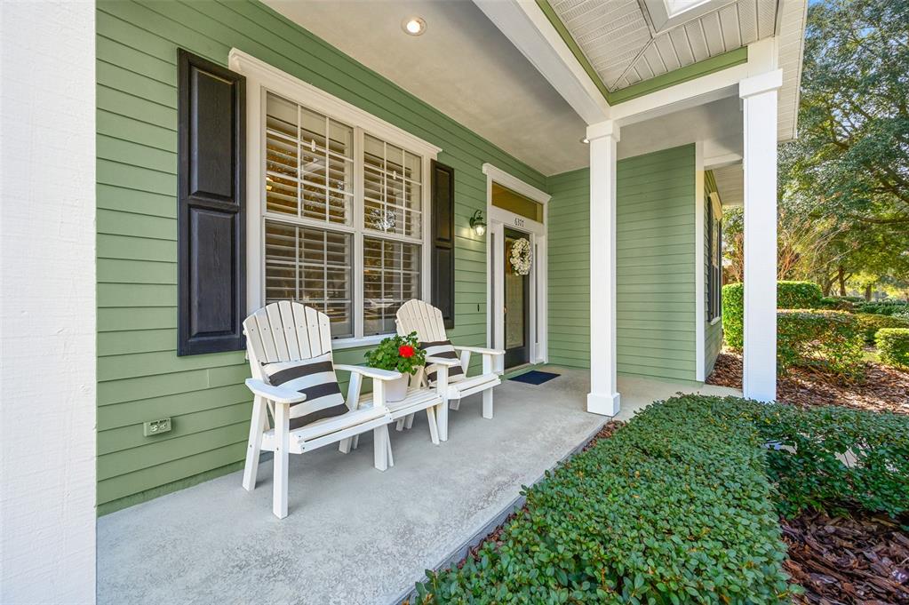 6377 Southwest 88th Terrace Gainesville, FL 32608 - Photo 3 of 37 a chair and a table in a backyard