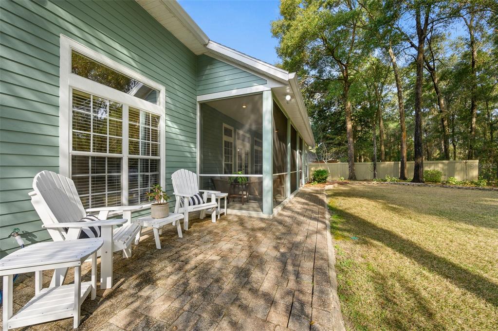 6377 Southwest 88th Terrace Gainesville, FL 32608 - Photo 33 of 37 a view of a chair and tables in the patio of the house