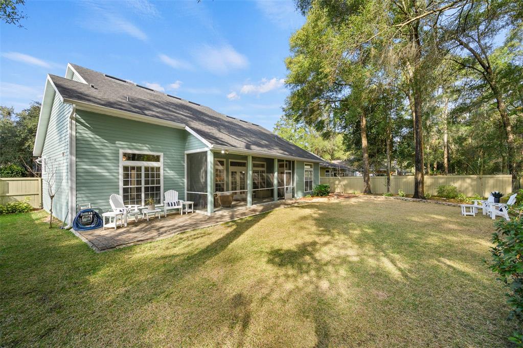 6377 Southwest 88th Terrace Gainesville, FL 32608 - Photo 35 of 37 a view of a house with a yard and sitting area
