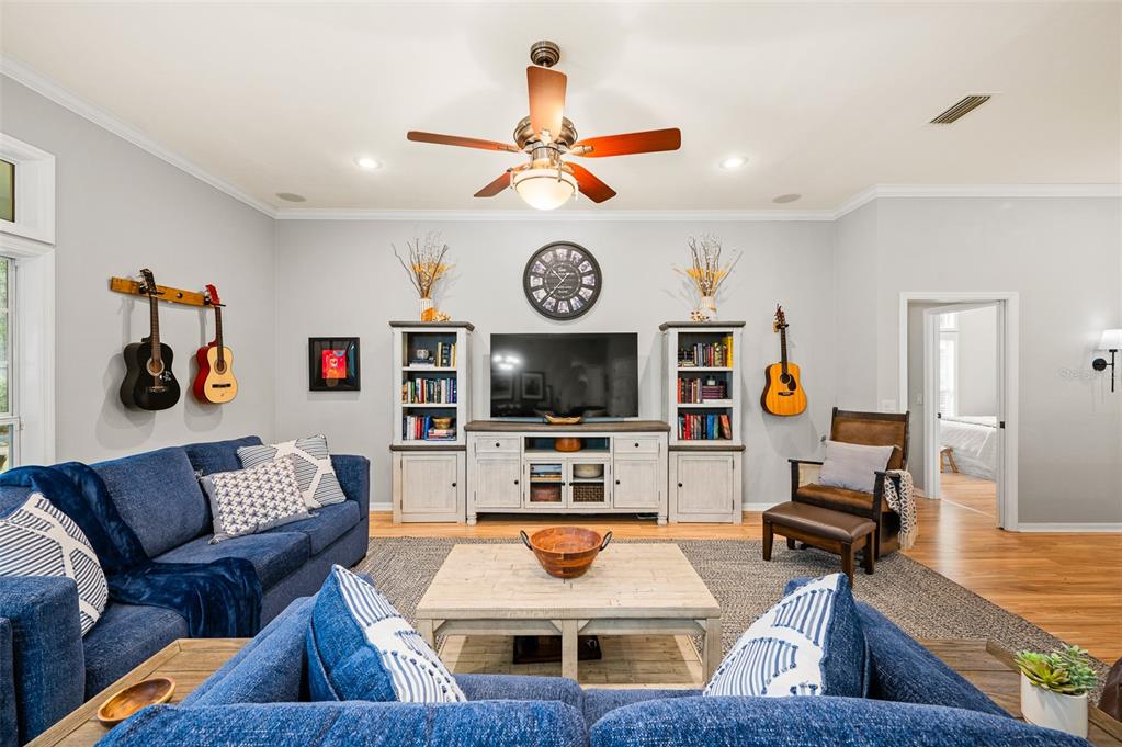 6377 Southwest 88th Terrace Gainesville, FL 32608 - Photo 9 of 37 a living room with furniture and a flat screen tv