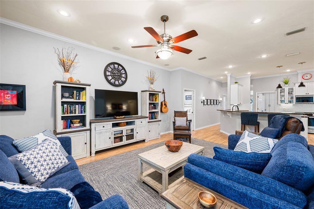 6377 Southwest 88th Terrace Gainesville, FL 32608 - Photo 10 of 37 a living room with furniture and a flat screen tv