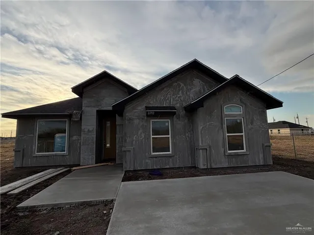 front view of a house with a street