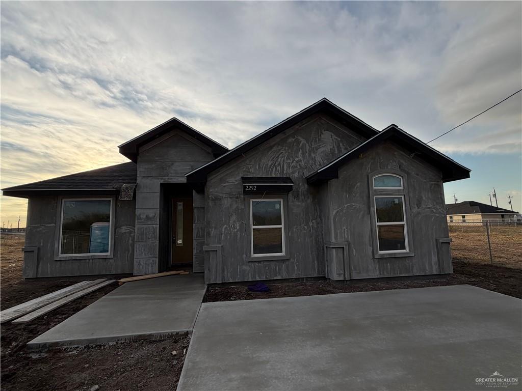 front view of a house with a street