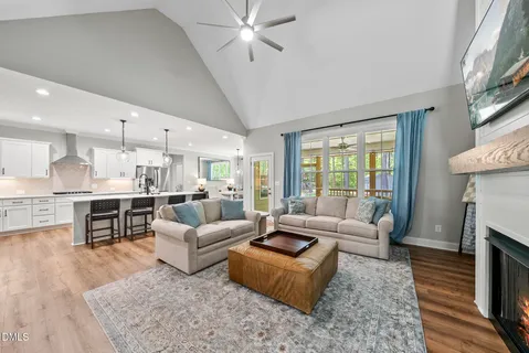 a view of a livingroom with furniture window and wooden floor