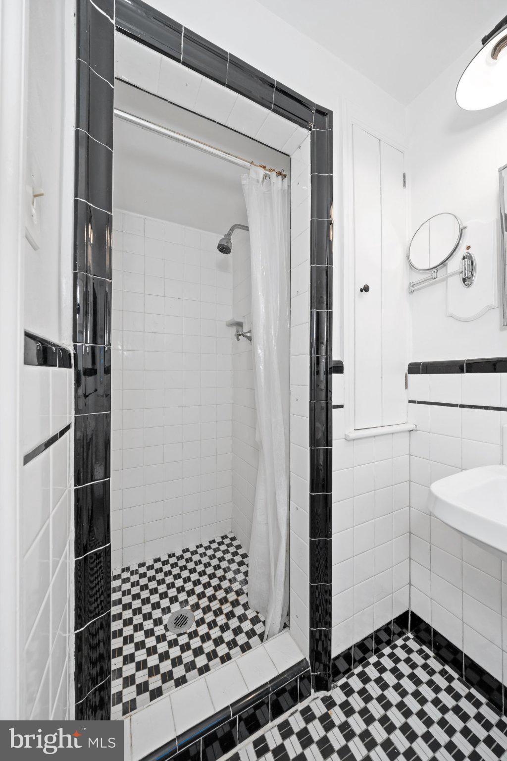 512 Lennox Road Wilmington, DE 19809 - Photo 19 of 28 Chic black-and-white tiled shower.
