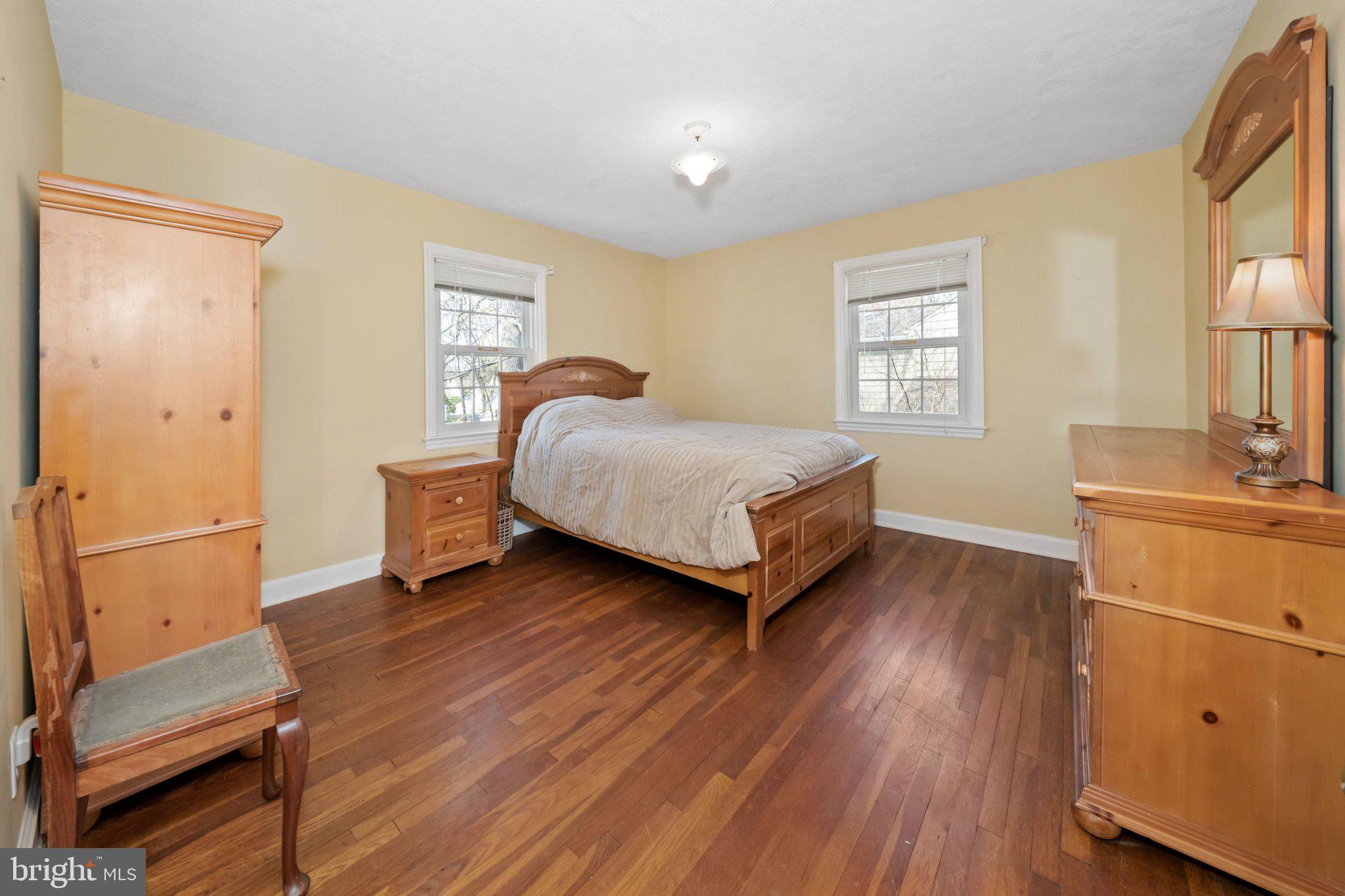 512 Lennox Road Wilmington, DE 19809 - Photo 20 of 28 Cozy bedroom with warm wooden tones.