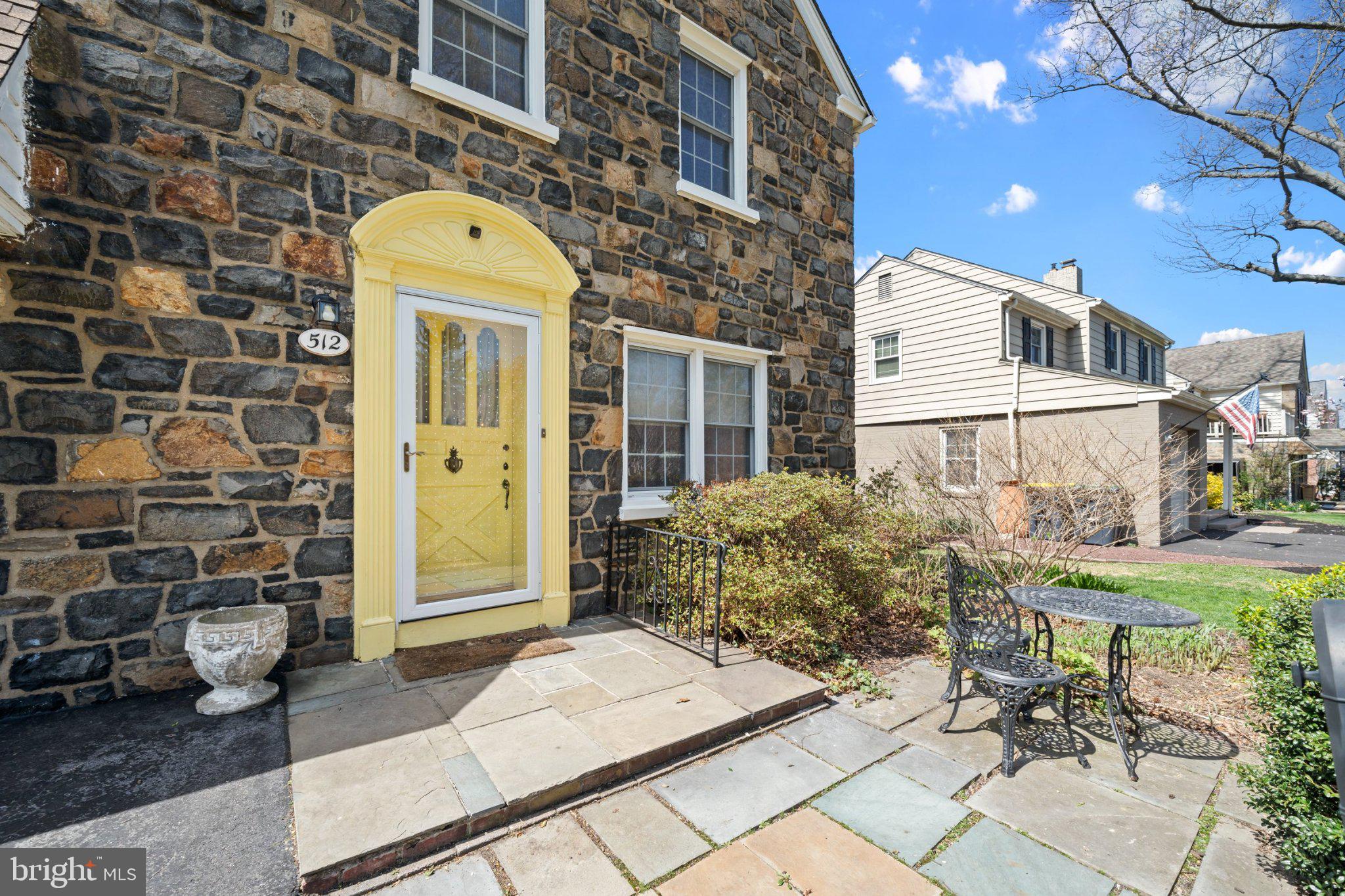512 Lennox Road Wilmington, DE 19809 - Photo 5 of 28 Charming stone facade with yellow door.