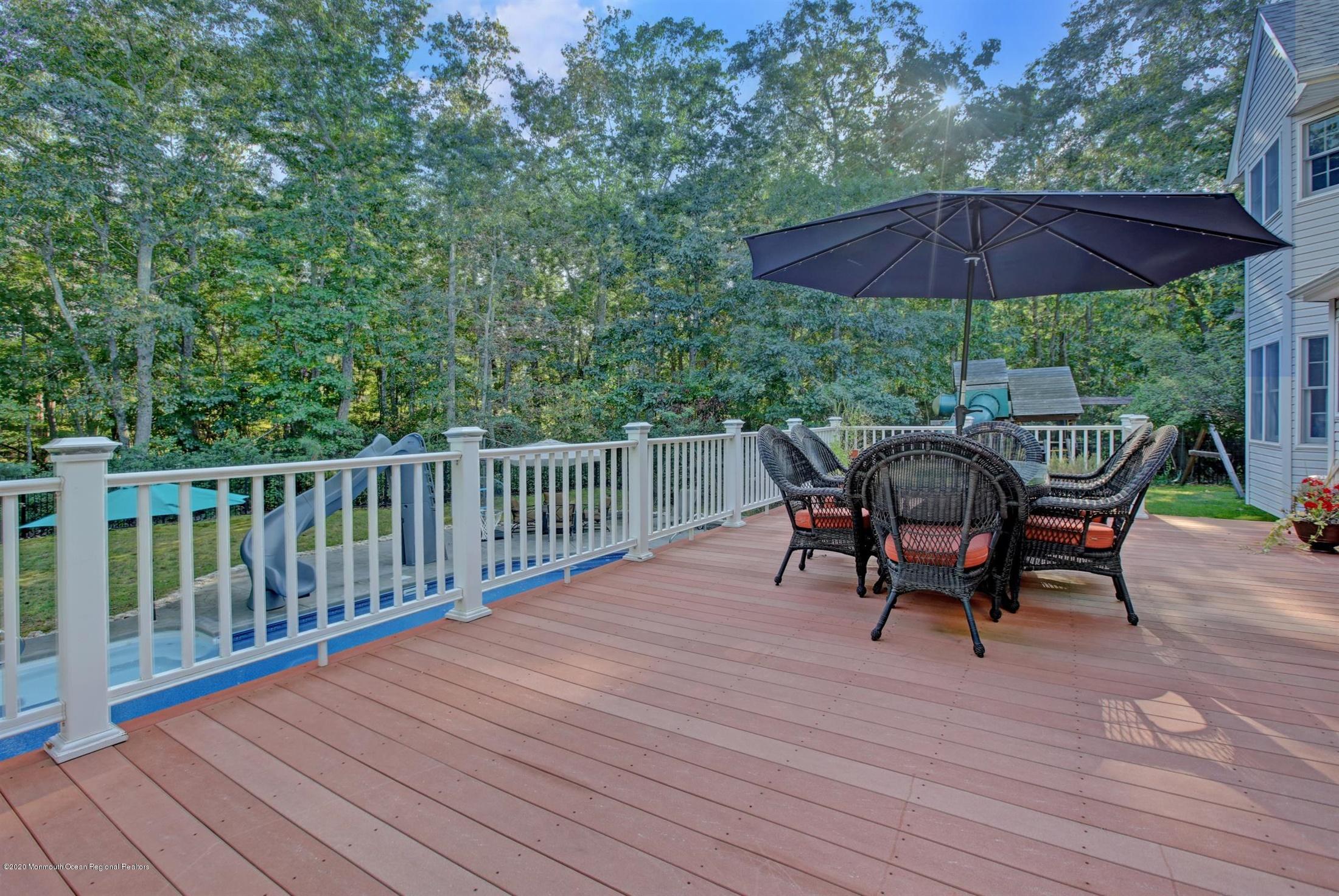 34 Jon Drive Barnegat, NJ 08005 - Photo 11 of 14 a view of a table and chairs on the deck
