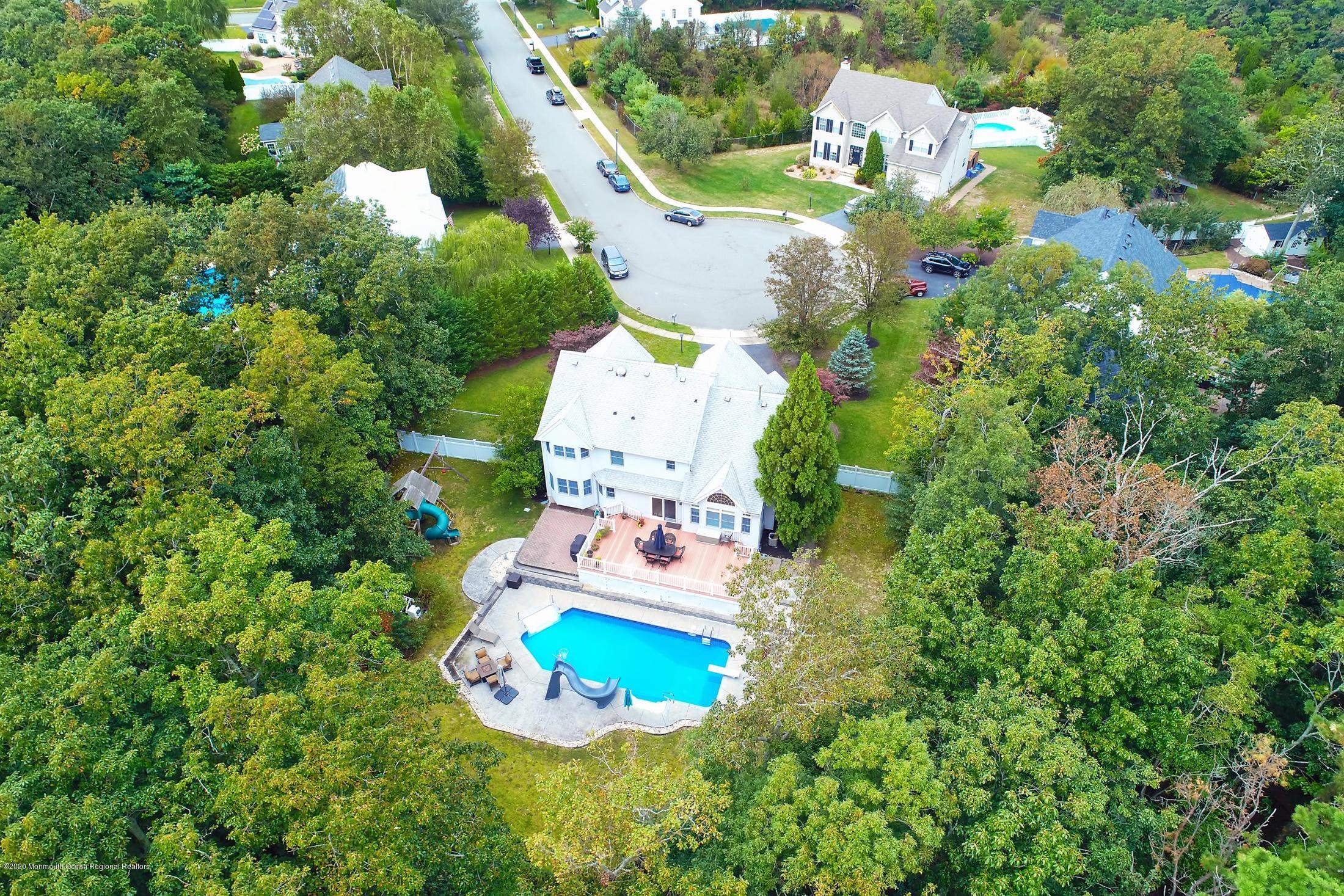 34 Jon Drive Barnegat, NJ 08005 - Photo 2 of 14 an aerial view of a house with a yard and large trees